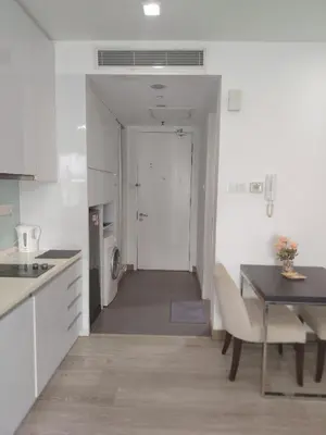 a kitchen with a table and a dining room at One bukit ceylon Mardeka Tower View in Kuala Lumpur