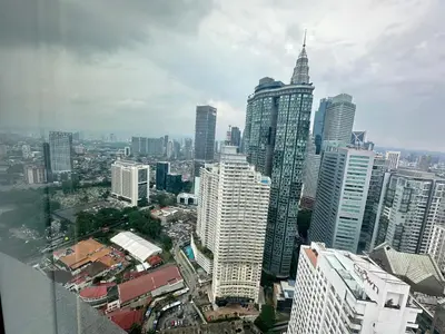 a city skyline with tall buildings in a city at Vortex Suites KLCC by Angel in Kuala Lumpur