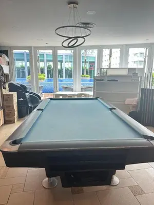 a pool table in the middle of a living room at Vortex Suites KLCC by Angel in Kuala Lumpur