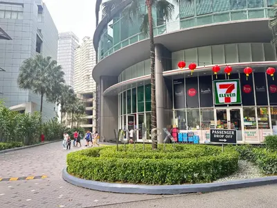 a building with people walking in front of it at Vortex Suites KLCC by Angel in Kuala Lumpur