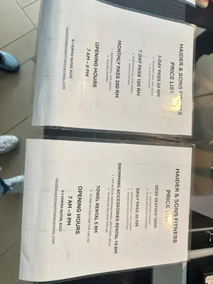two white tickets are sitting on a table at Vortex Suites KLCC by Angel in Kuala Lumpur
