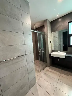 a bathroom with a shower and a sink at Opus Residence in Kuala Lumpur