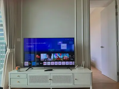 a flat screen tv sitting on top of a white cabinet at KLCC View Datum Jelatek Escape by Filux Holiday in Kampong Datok Keramat