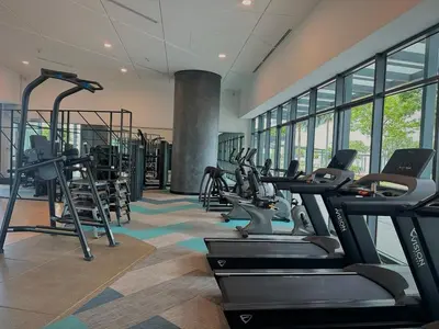 a gym with treadmills and ellipticals in a building at KLCC View Datum Jelatek Escape by Filux Holiday in Kampong Datok Keramat