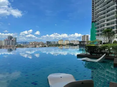 a large pool of water in a city with buildings at KLCC View Datum Jelatek Escape by Filux Holiday in Kampong Datok Keramat