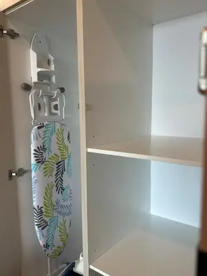 a skateboard is hanging on a rack in a closet at KLCC View Datum Jelatek Escape by Filux Holiday in Kampong Datok Keramat