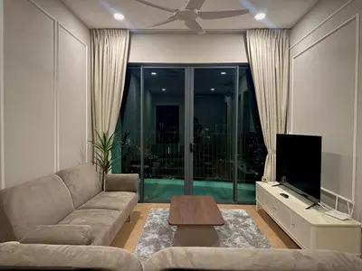 a living room with a couch and a flat screen tv at KLCC View Datum Jelatek Escape by Filux Holiday in Kampong Datok Keramat