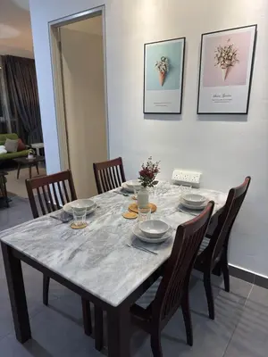 a dining room table with chairs and a gray table cloth at Sentrio Pandan KL KLCC View Kuala Lumpur 37 in Kuala Lumpur