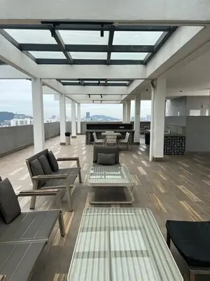 a living room with couches and tables on a building at Sentrio Pandan KL KLCC View Kuala Lumpur 37 in Kuala Lumpur