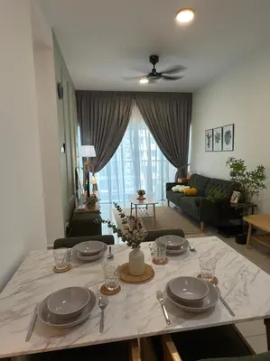 a living room with a table with plates on it at Razak Residence KL Area Cozy & Simple RC B2 18 in Kuala Lumpur