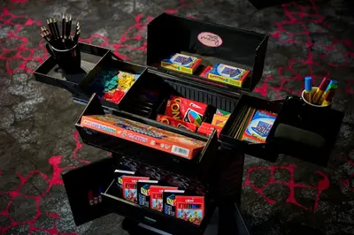 a table with two boxes filled with school supplies at Moxy Kuala Lumpur Chinatown in Kuala Lumpur