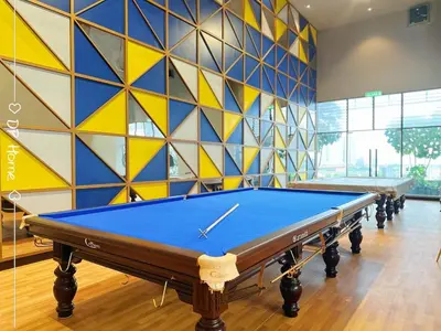 a pool table in a room with a colorful wall at Studio KL Trion for 2-3 pax KL TRX Velocity in Kuala Lumpur