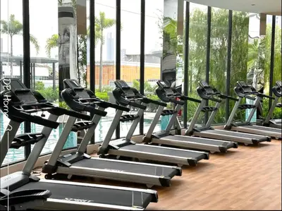 a row of tread machines in a gym at Studio KL Trion for 2-3 pax KL TRX Velocity in Kuala Lumpur