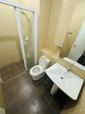 a bathroom with a toilet and a sink at Taragon Standard Homestay in Kuala Lumpur