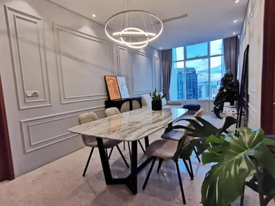 a dining room with a table and chairs at Sky Suites KLCC host by REST Corner Suites in Kuala Lumpur