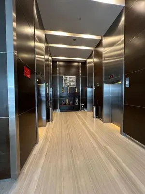 a hallway with many elevators in a building at 1 Bukit Ceylon Kuala Lumpur in Kuala Lumpur