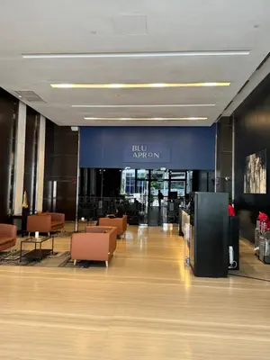 a lobby with chairs and a sign in a building at 1 Bukit Ceylon Kuala Lumpur in Kuala Lumpur