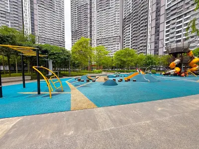 a playground in a park with slides and swings at M Vertica Cheras by RASBO Galaxy Suites in Kuala Lumpur