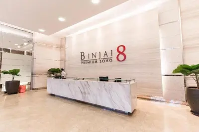 a lobby with a large sign on a wall at Binjai 8Premium KL city Walkabke to KLCC By MWM in Kuala Lumpur