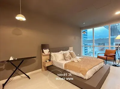 a bedroom with a bed and a table and a desk at Binjai 8Premium KL city Walkabke to KLCC By MWM in Kuala Lumpur