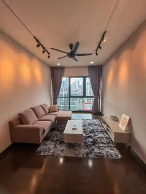 a living room with a couch and a table at Sunway Velocity in Kuala Lumpur