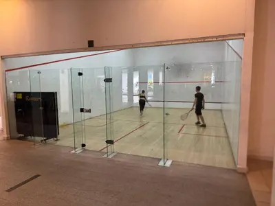 a man and a woman playing a game of squash at Infinity Skypool Ladies Room in Hostel in Kuala Lumpur