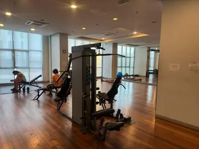 a gym with people exercising in the gym at Infinity Skypool Ladies Room in Hostel in Kuala Lumpur