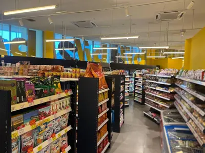 a grocery store aisle with a lot of products at Infinity Skypool Retreat hostel in Kuala Lumpur