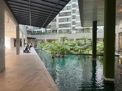 a hallway with a pool of water in a building at KL Infinity Luxury Skypool hostel in Kuala Lumpur