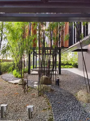 a courtyard with bamboo trees and a building at Lucentia Residence, Bukit Bintang City Centre in Kuala Lumpur
