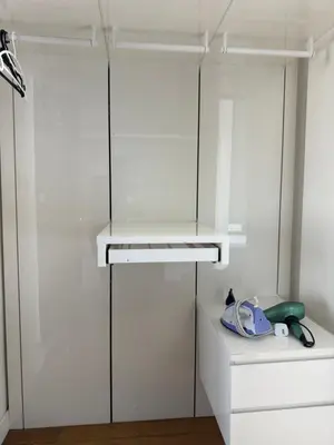 a kitchen with white cabinets and a white shelf at The Platinum Kuala Lumpur by Skyscraper in Kuala Lumpur