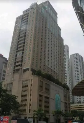 a large tall building in the middle of a city at Maytower Studio in Kuala Lumpur