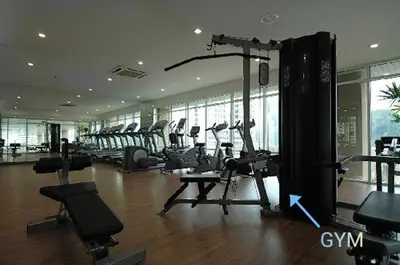 a gym with treadmills and machines in a building at Maytower Studio in Kuala Lumpur