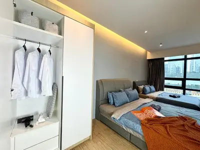 a bedroom with a bed and a couch and a window at Weekly Monthly Stay - Bangsar Trade Centre Benton in Kuala Lumpur