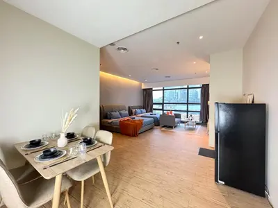 a living room with a couch and a table at Weekly Monthly Stay - Bangsar Trade Centre Benton in Kuala Lumpur
