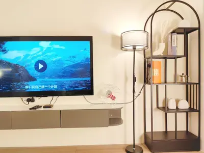 a flat screen tv sitting on top of a wall at Weekly Monthly Stay - Bangsar Trade Centre Aspire in Kuala Lumpur