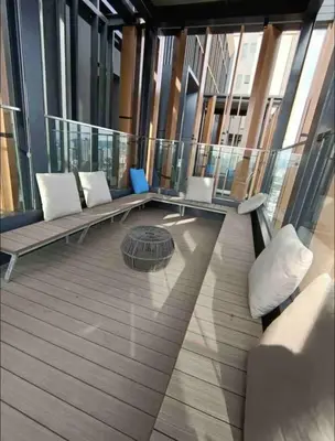 a balcony with benches and a table on a building at BEST 4-5pax KL Amazing View SkyPool Bukit Bintang in Kuala Lumpur