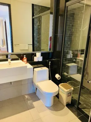 a bathroom with a toilet and a sink and a shower at The Mews KLCC By SKY GARDEN in Kuala Lumpur