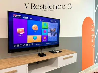 a flat screen tv sitting on top of a table at 2Room 8pax Link to Velocity Mall MRT KL in Kuala Lumpur