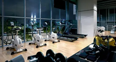a gym with treadmills and exercise equipment in a building at Lucentia Residences by Luxe Suites in Bukit Bintang KLCC! in Kuala Lumpur