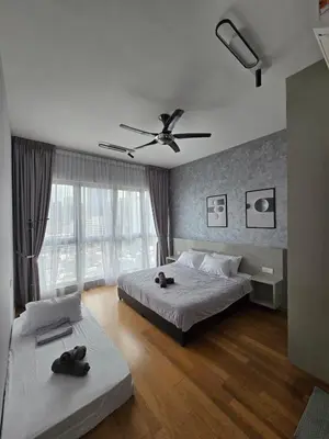 a bedroom with two beds and a ceiling fan at KLCC SOGO new 2R2B LRT PWTC Sunway Putra Sky Pool in Kuala Lumpur