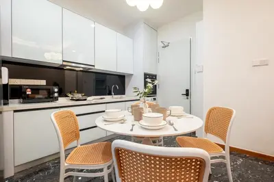 a kitchen with a table and chairs in a room at Le Luxe de KL 2BR with Bath Tub 10 min to KLCC in Kuala Lumpur