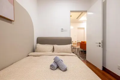 a bed with a pillow on it in a room at Le Luxe de KL 2BR with Bath Tub 10 min to KLCC in Kuala Lumpur