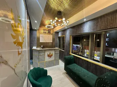 a store lobby with a green couch and a counter at SS GREY INN Jalan bukit bintang in Kuala Lumpur