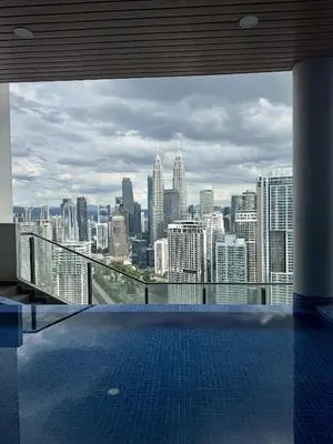 a view of a city skyline from a swimming pool at XING LUN KLCC The Colony Infinitum in Kuala Lumpur