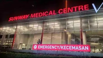 a building with a red sign in front of it at Big Group 3R2B Sunway Velocity KL Walking distance to Monorail in Kuala Lumpur