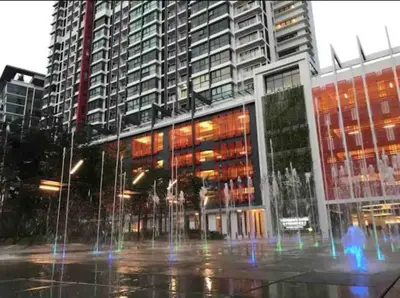 a fountain in front of a building with tall buildings at Big Group 3R2B Sunway Velocity KL Walking distance to Monorail in Kuala Lumpur