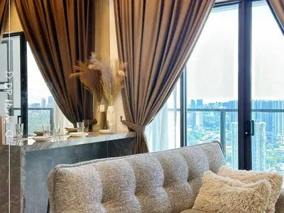 a living room with a couch in front of a window at Luxury Homestay KL Center 6-8pax TRX-Velocity-Ikea in Kuala Lumpur