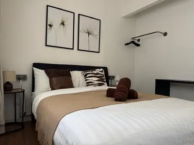 a bedroom with a bed with a teddy bear on it at M Vertica E33A10 l 4 Bedroom l 8 Pax in Kuala Lumpur