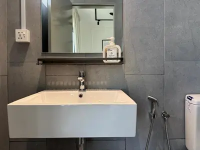 a white sink in a bathroom with a mirror at M Vertica E33A10 l 4 Bedroom l 8 Pax in Kuala Lumpur